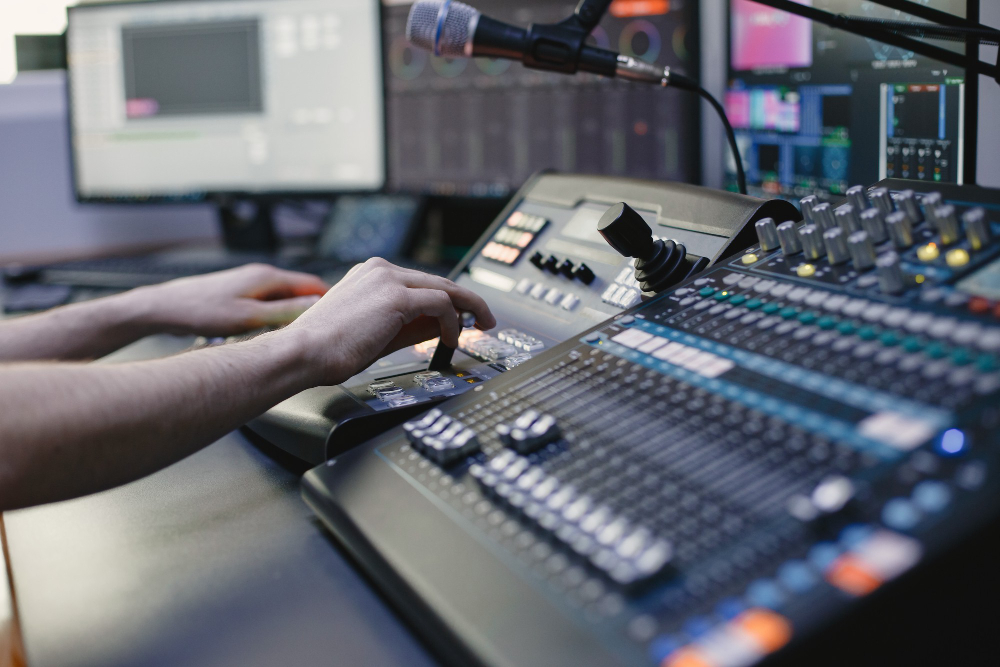 close up sound engineer hands recording music