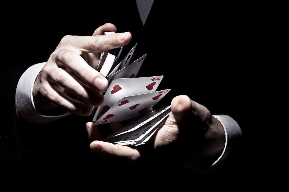 magician shuffling cards cool way spotlight