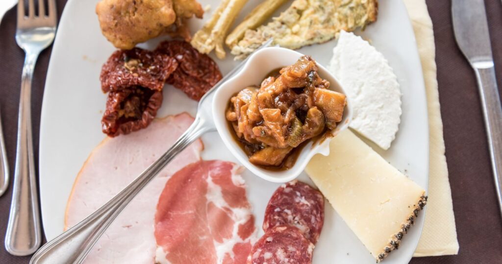 a charcuterie and cheese plate in sicily, italy