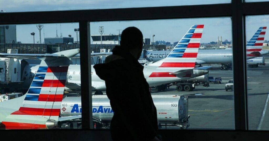 silhouette of a person with airplanes behind them