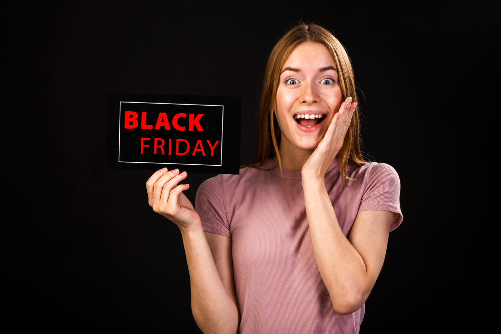 front view enthusiastic woman holding black friday card